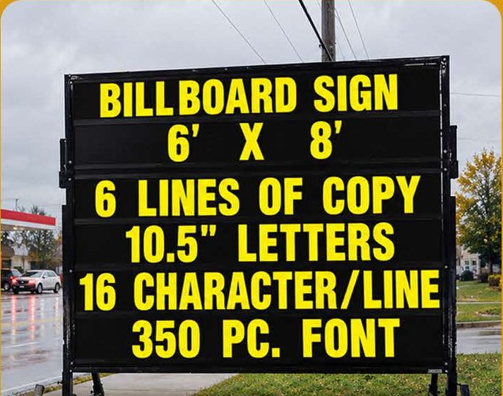Yellow letters on black over six lines of track on a 6 × 8 ft board.